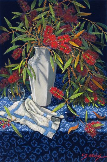 Red flowers in a white vase