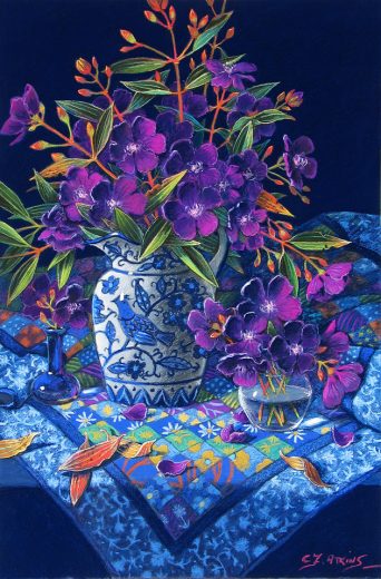 A jug of tibouchina flowers rests on a Log Cabin Quilt.