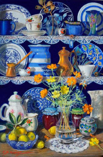 Shelves of patterned objects are behind a vase of flowers.