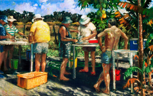 Fishermen stand around tables cleaning a catch of fish.