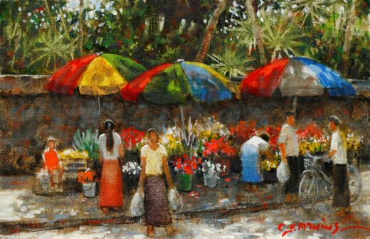 Workers sell brightly coloured flowers at a roadside market in Yangon, Burma.