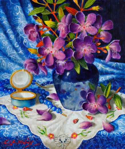 Purple flowers and leaves are in a blue vase.