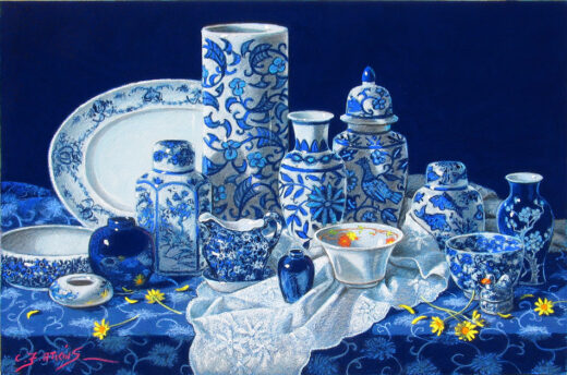 A collection of blue and white china stands on a shelf.