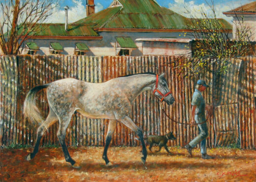 A man leads a horse past a tall corrugated iron fence. A black dog also follows.