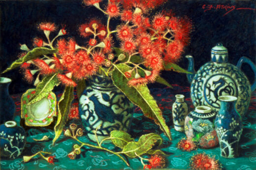 A jug holding gum blossoms is accompanied by a teapot adorned with a dragon motif.