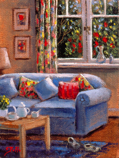 A comfortable sofa is in front of windows.