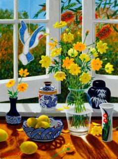 Light streams in through an open window, lighting up a vase of yellow flowers.