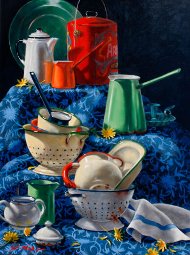 A collection of coloured enamelware.