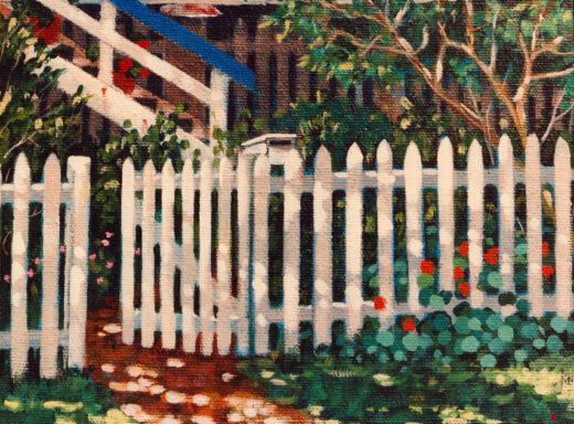 Nasturtiums and white fence outside a high-set house.