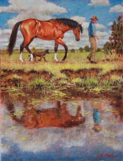 A stockman leads his horse past a pool of still water.