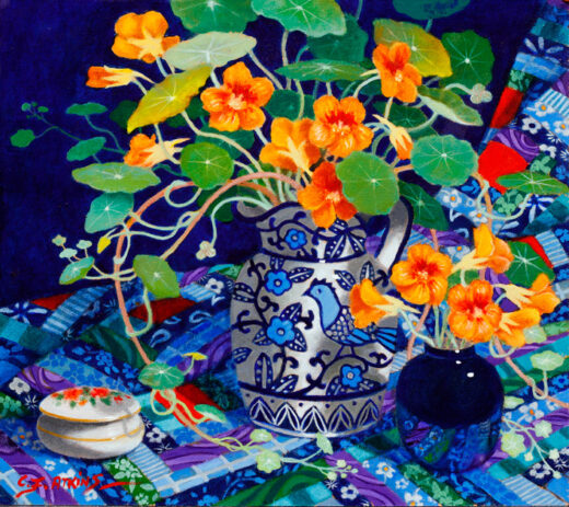 A colourful display of nasturtium flowers in a ceramic jug.