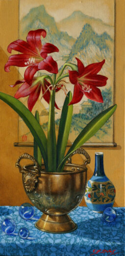 Large red flowers and broad green leaves spring from a brass container.