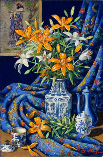 A vase contains orange and white lilies. An oriental wall hanging of a woman playing a flute is behind the vase of flowers.