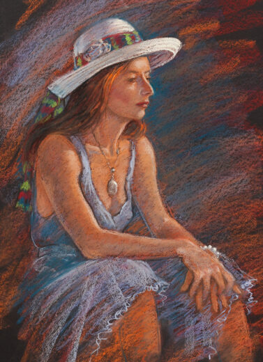 A lady in a hat rests with her arms on her knees.
