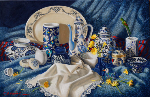 A ceramic coffee pot and a large decorated plate are the major items in this still life. A small duck sits in the foreground.
