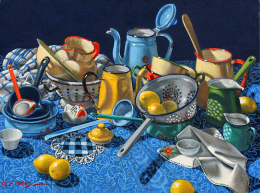 Various pieces of kitchenalia rest on a patterned cloth. Some lemons are scattered among the enamelware. 
