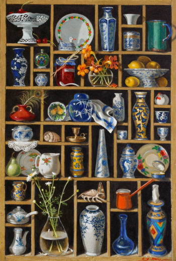 Lots of small objects are displayed in a set of shelves. A bowl of lemons is in one of the box-like spaces.