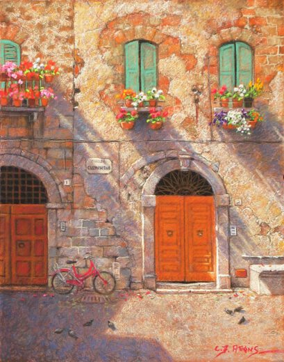Long shadows stretch across this ancient wall in Italy. The shadows are cast by colourful blooming window boxes that decorate the wall. A bicycle rests at the base of the wall.