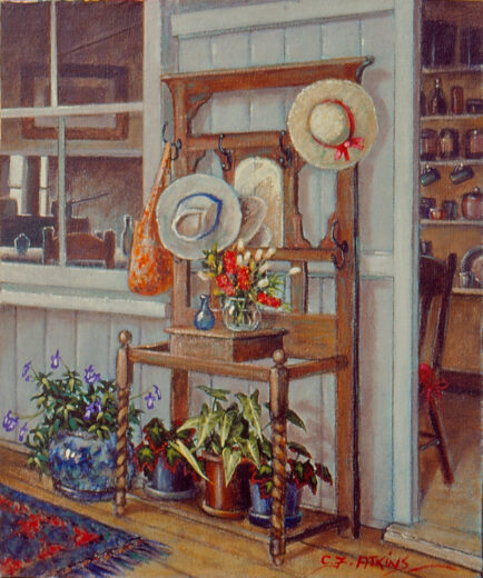A hat stand with associated plants is just outside the kitchen of this old house.